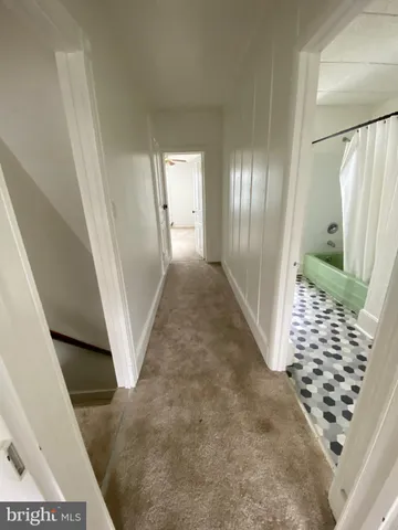a view of entryway with stairs and wooden floor