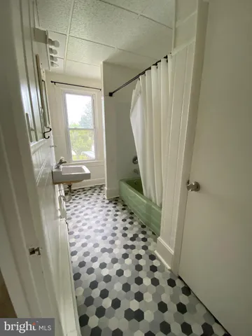 a bathroom with a sink and a shower