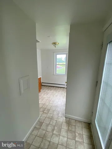 a view of an empty room and window