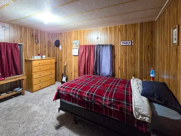 a bedroom with a bed and a closet