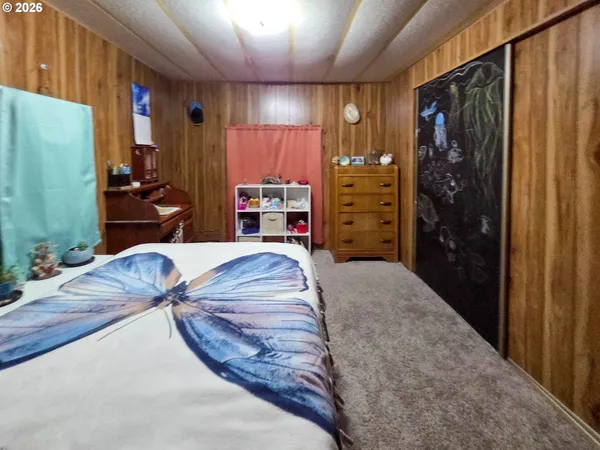 a bed room with a bed and a walk in closet