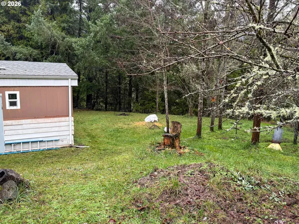 a backyard of a house with lots of green space