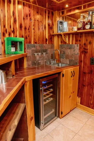 a view of a kitchen with a sink and cabinets