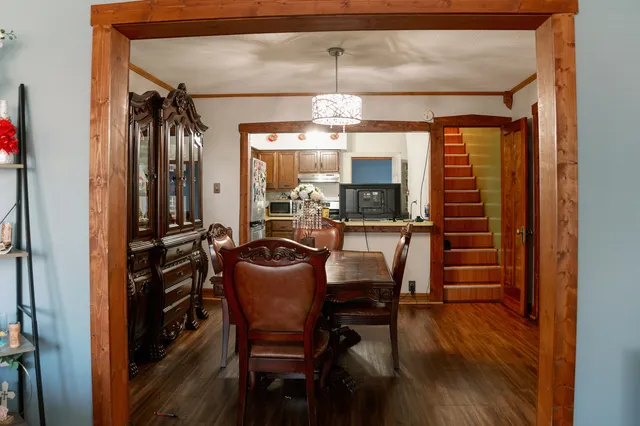 a dining room with furniture and window