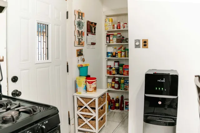 a bedroom with furniture and a book shelf