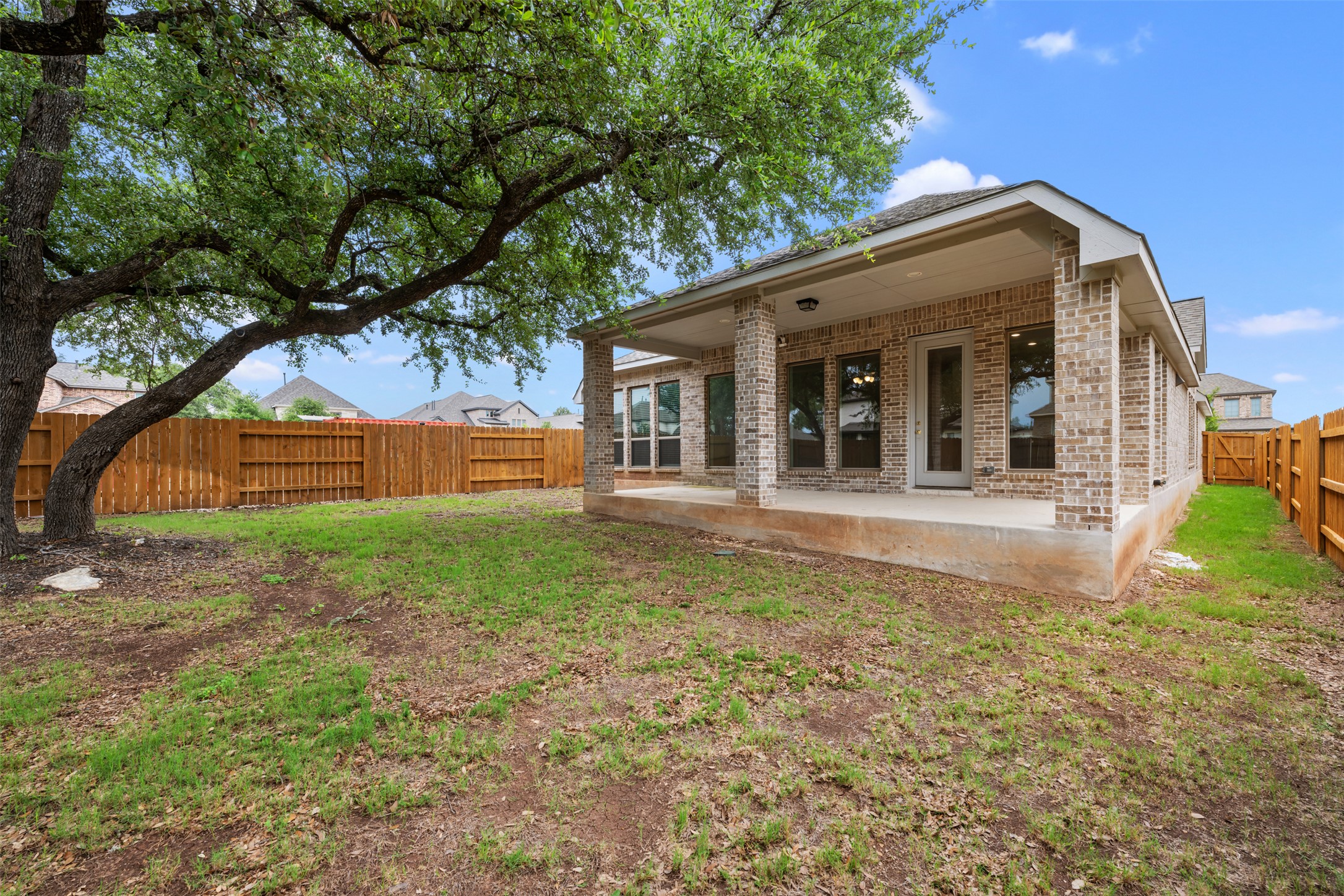 104 Anejo Bluff Georgetown, TX 78628 - Photo 36 of 40 a view of a house with backyard and tree
