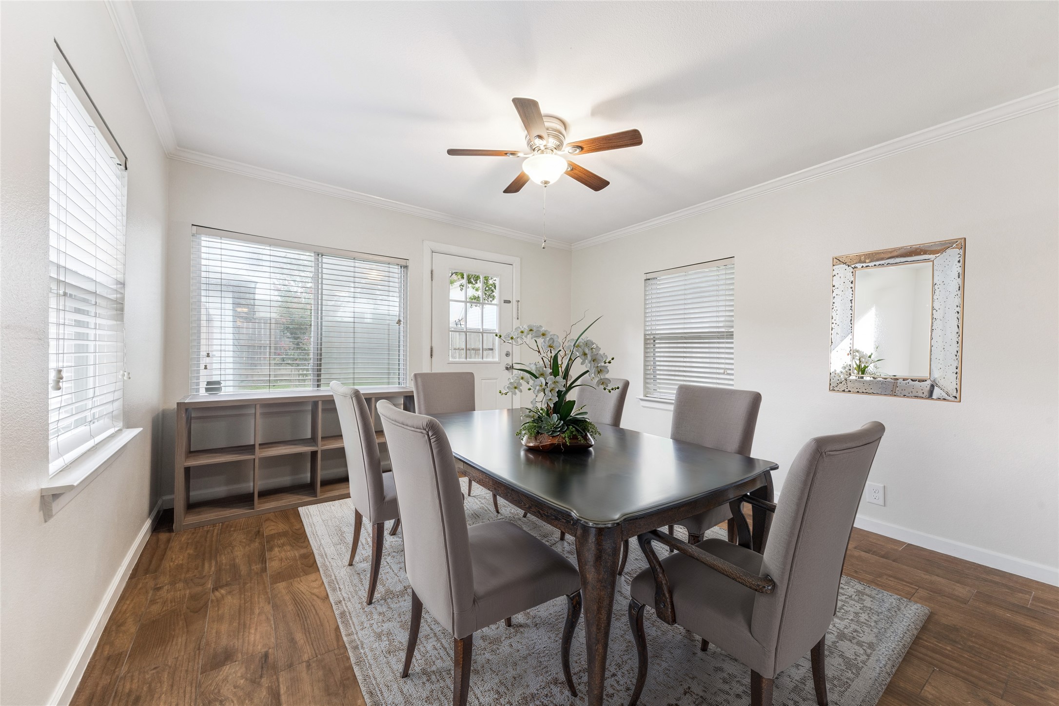 3810 Grennoch Lane Houston, TX 77025 - Photo 7 of 17 a view of a dining room with furniture window and wooden floor
