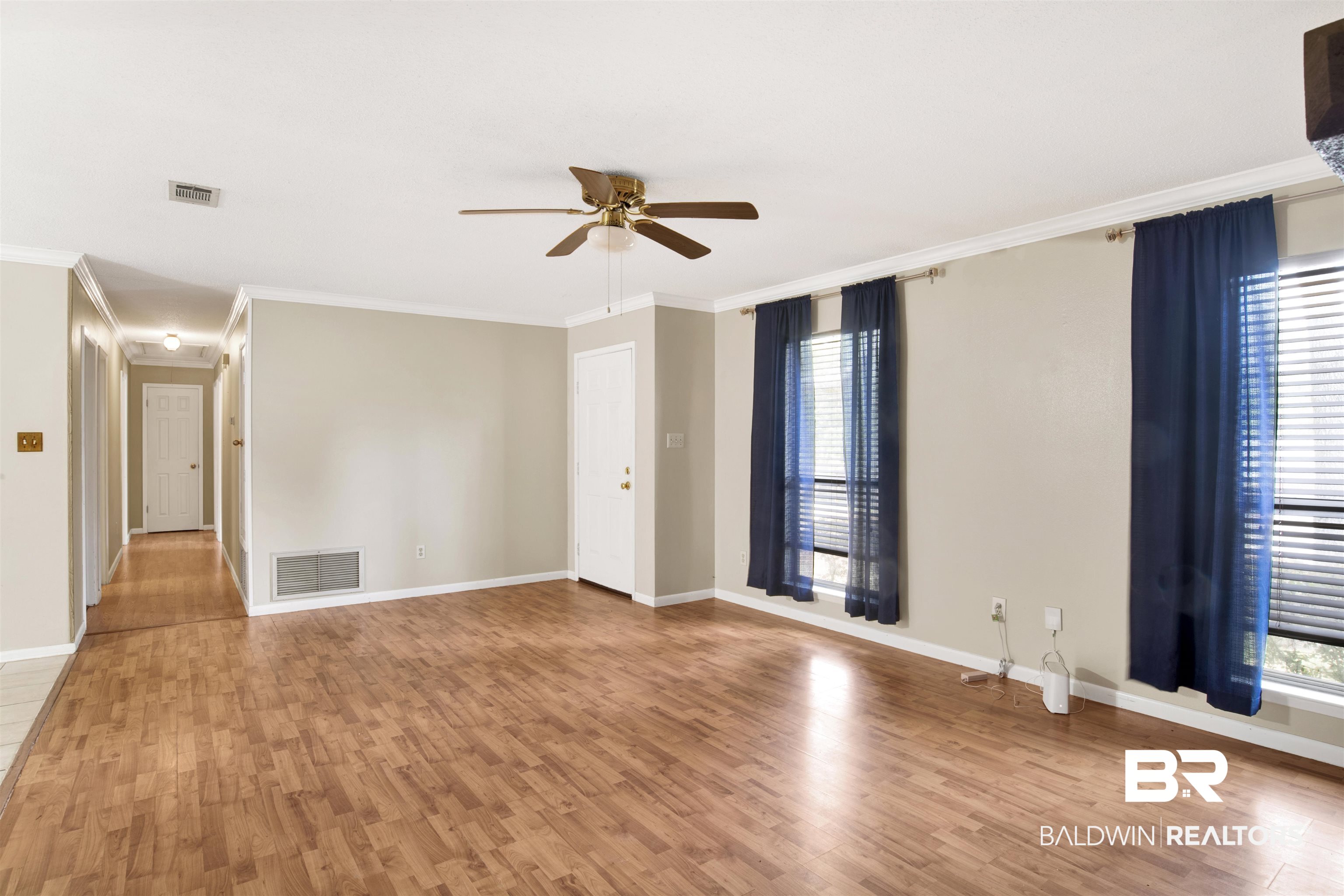 3560 Creekway Road Mobile, AL 36619 - Photo 18 of 24 Unfurnished room featuring ceiling fan, light wood-type flooring, and crown molding
