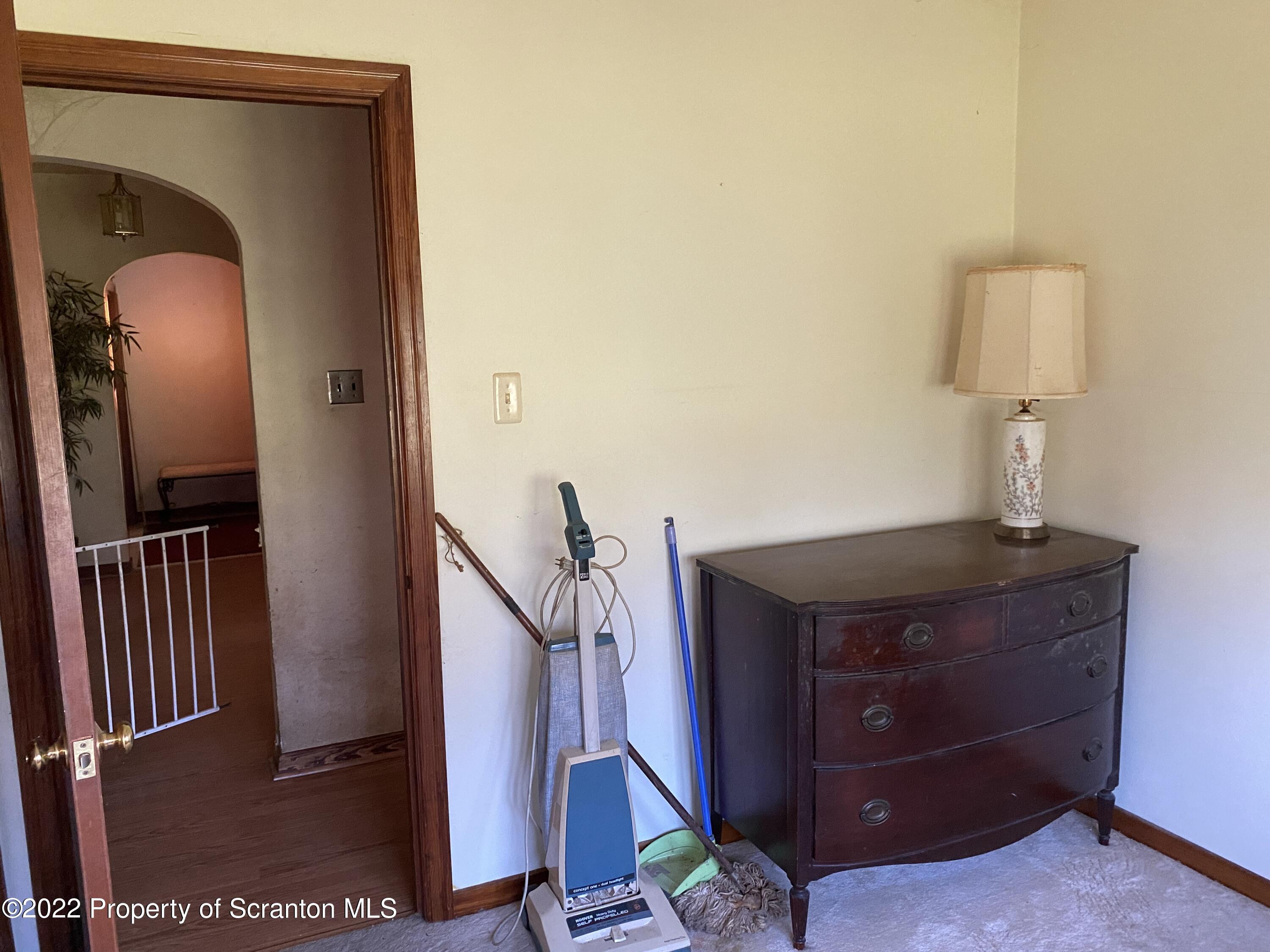 2008 South Webster Avenue Scranton, PA 18505 - Photo 13 of 37 a view of a hallway with a cabinet and a mirror
