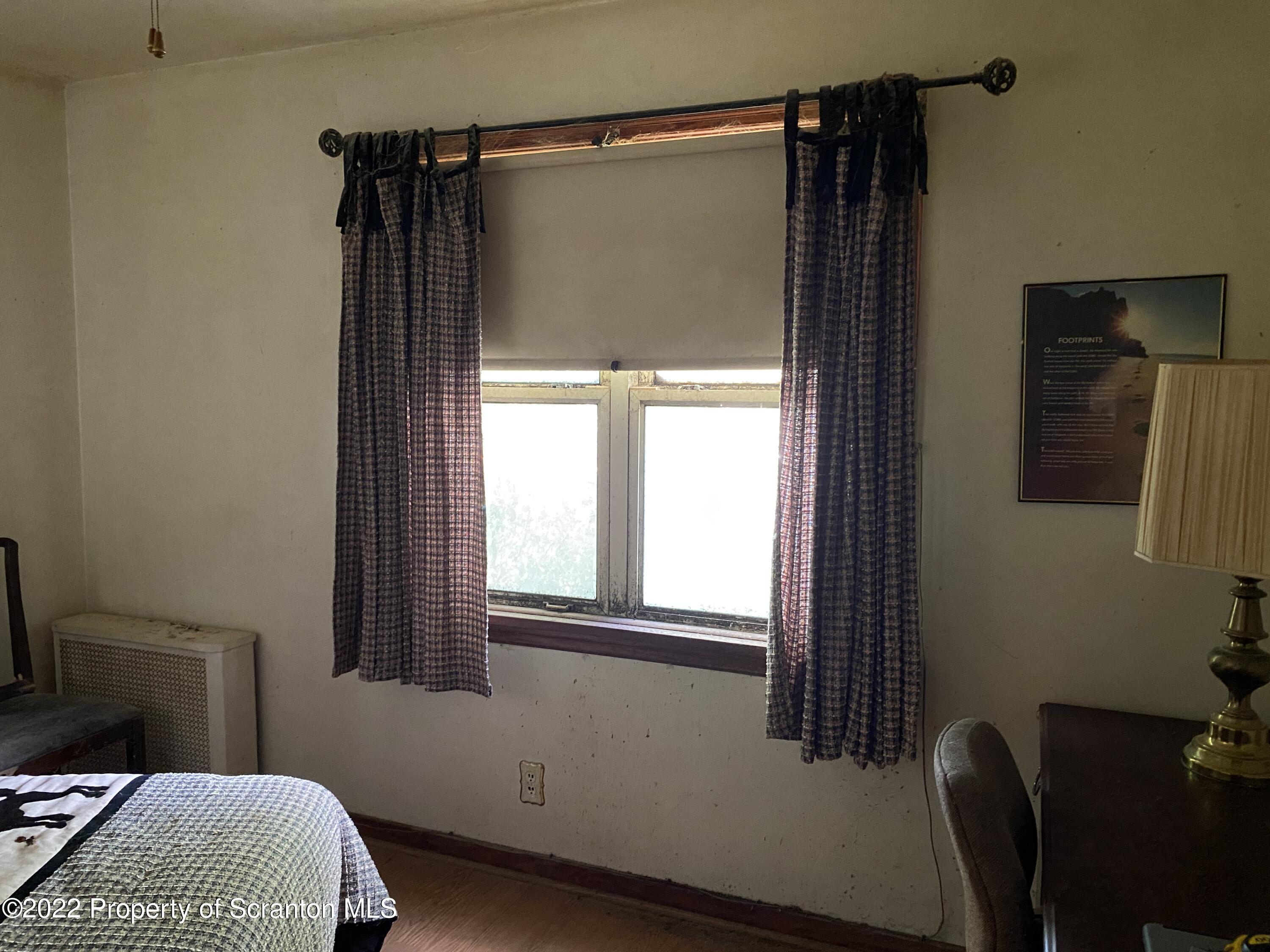 2008 South Webster Avenue Scranton, PA 18505 - Photo 16 of 37 a bedroom with a bed and a window