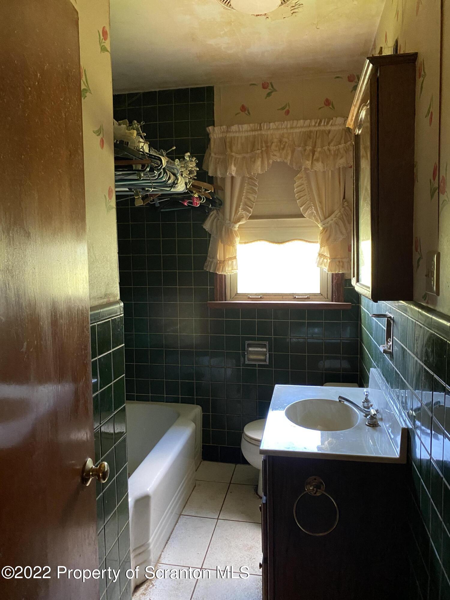 2008 South Webster Avenue Scranton, PA 18505 - Photo 20 of 37 a bathroom with a sink and mirror