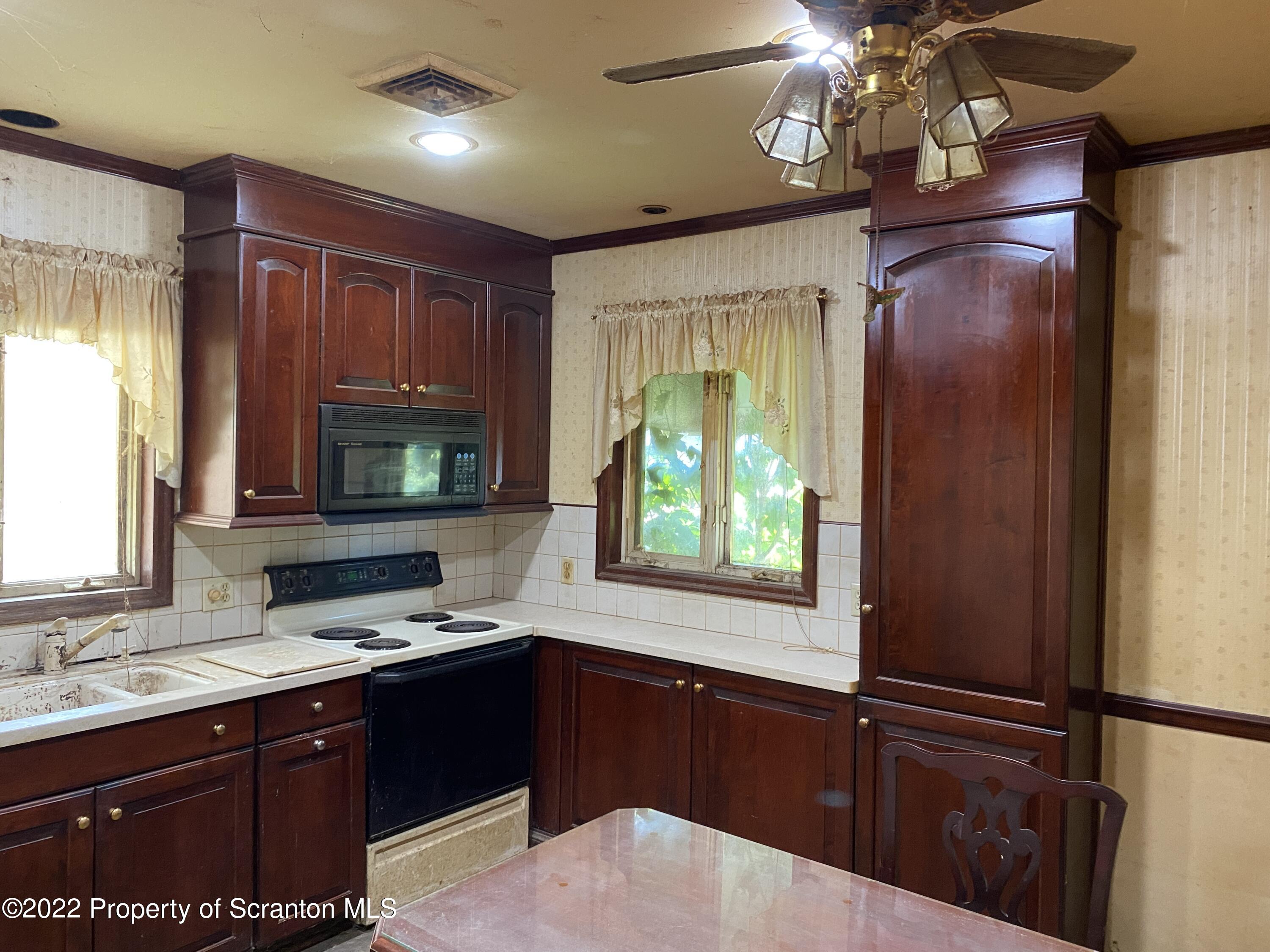 2008 South Webster Avenue Scranton, PA 18505 - Photo 8 of 37 a kitchen with a sink cabinets and window