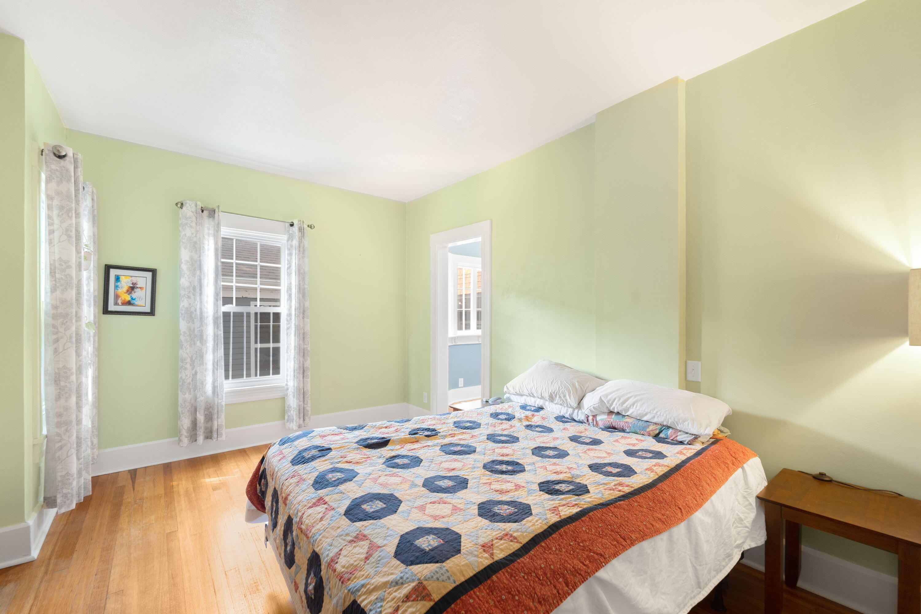 1213 College Avenue Racine, WI 53403 - Photo 14 of 31 Luxurious main-level retreat boasting a spa-like attached bath and an enormous walk-in closet with in-room laundry—combining comfort, style, and convenience in one perfect space.