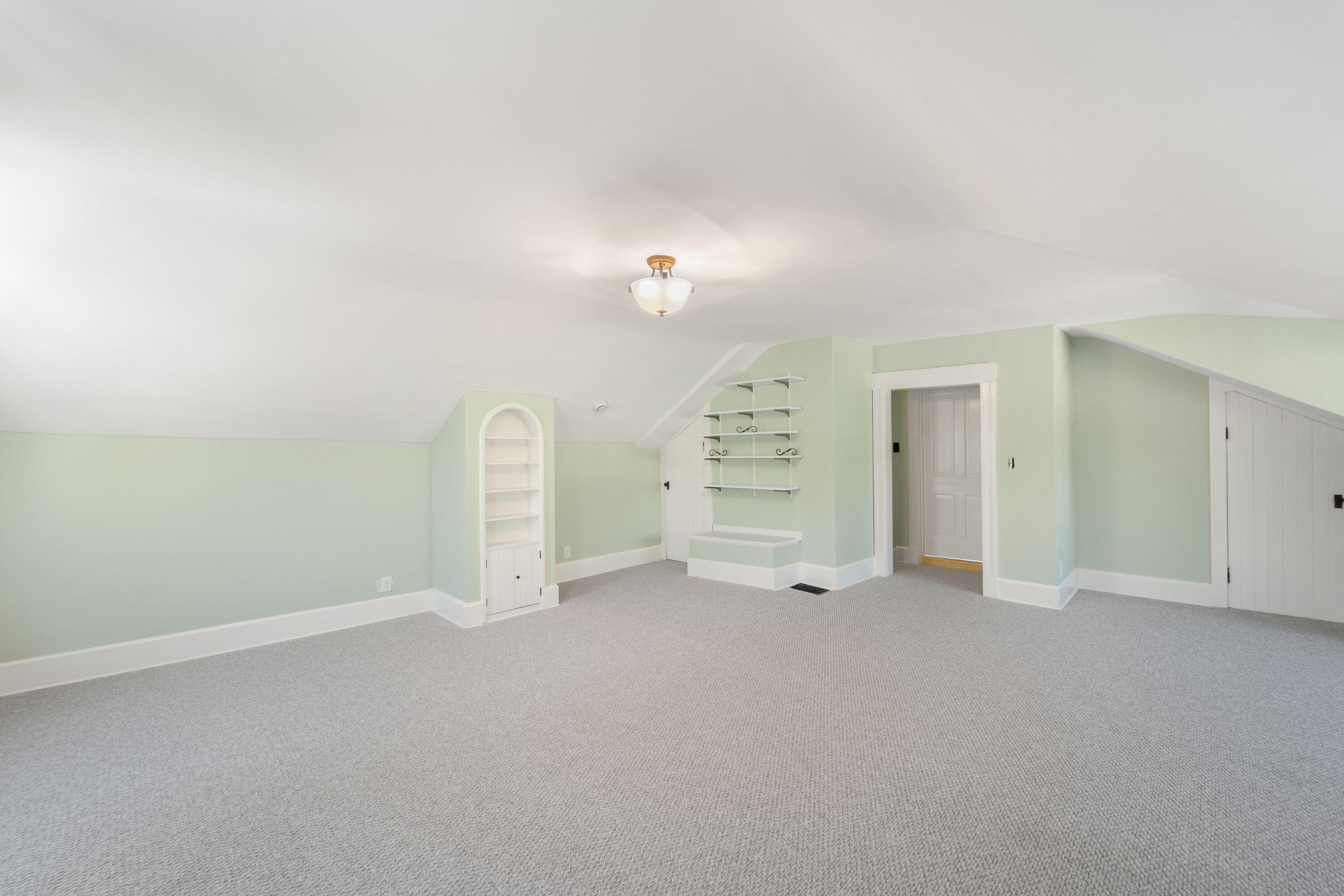 1213 College Avenue Racine, WI 53403 - Photo 20 of 31 Built-in shelves and generous closet space complete this extra-large bedroom suite, blending smart storage with timeless style for the perfect combination of beauty and function.