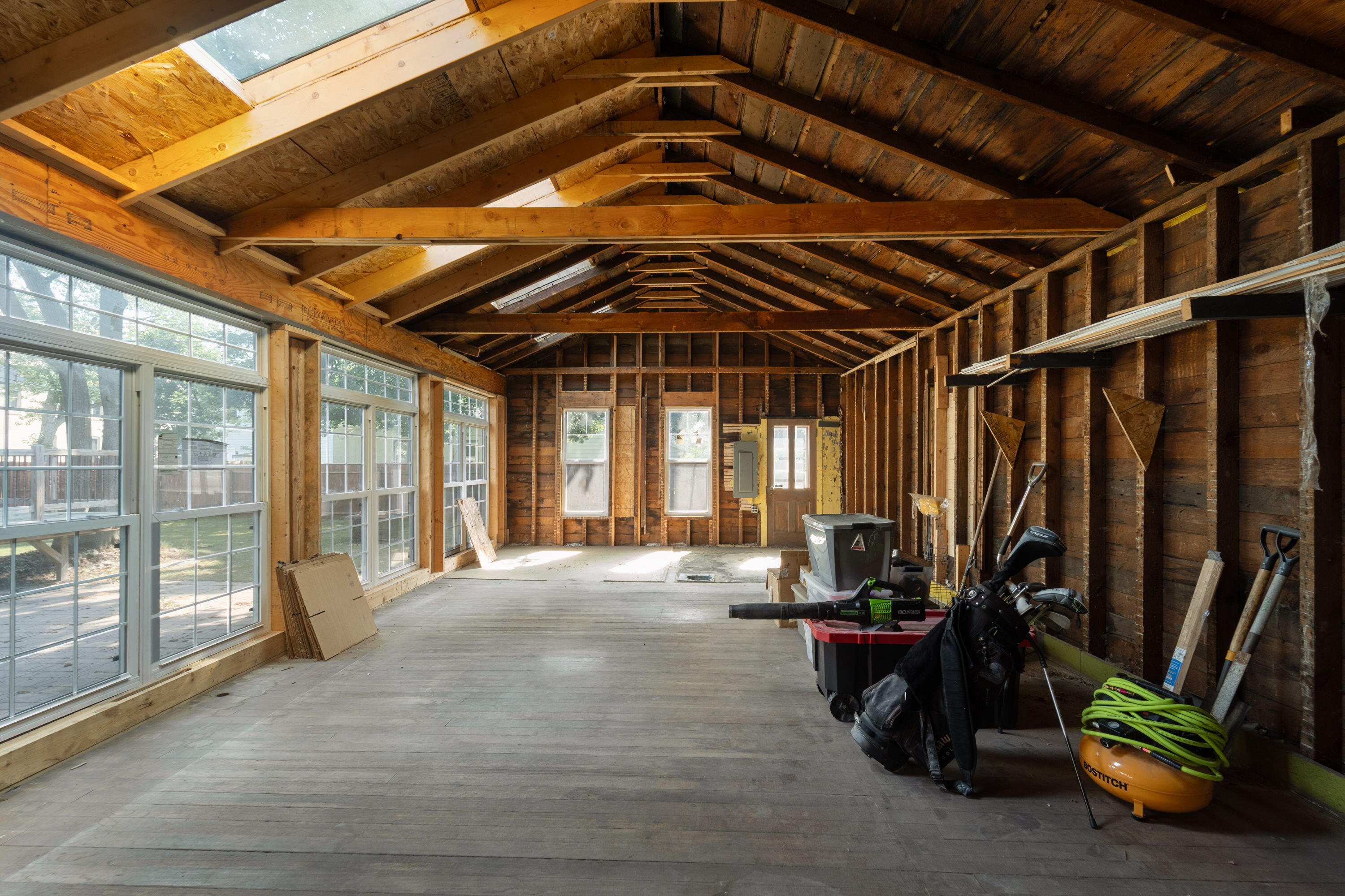 1213 College Avenue Racine, WI 53403 - Photo 25 of 31 Additional living space under construction featuring vaulted ceilings and endless potential to create your dream studio, guest suite, or entertainment area