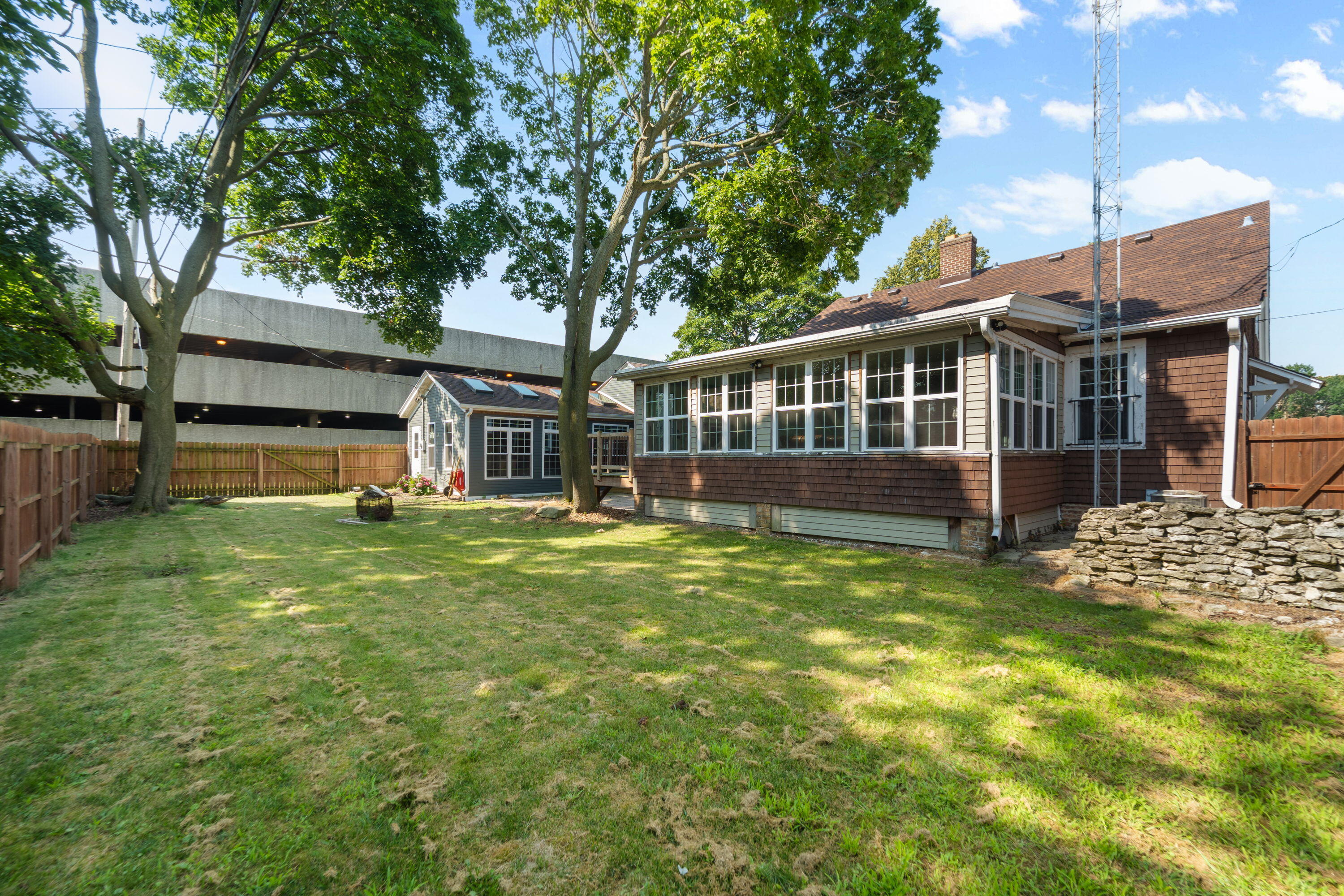 1213 College Avenue Racine, WI 53403 - Photo 28 of 31 Spacious fenced yard offers privacy, security, and plenty of room to enjoy the outdoors
