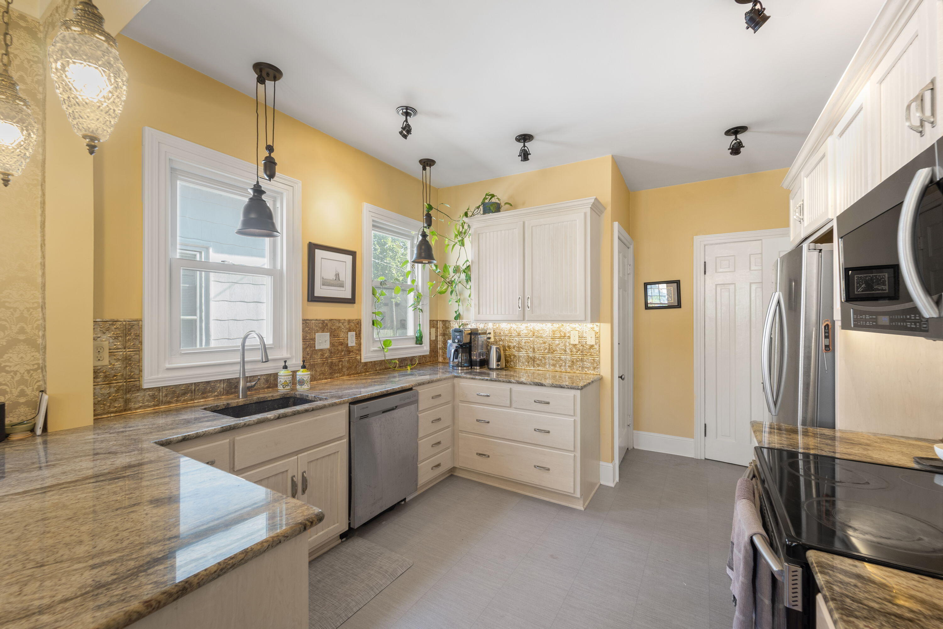 1213 College Avenue Racine, WI 53403 - Photo 8 of 31 Well-designed kitchen with a functional layout and ample countertop space for cooking and hosting.