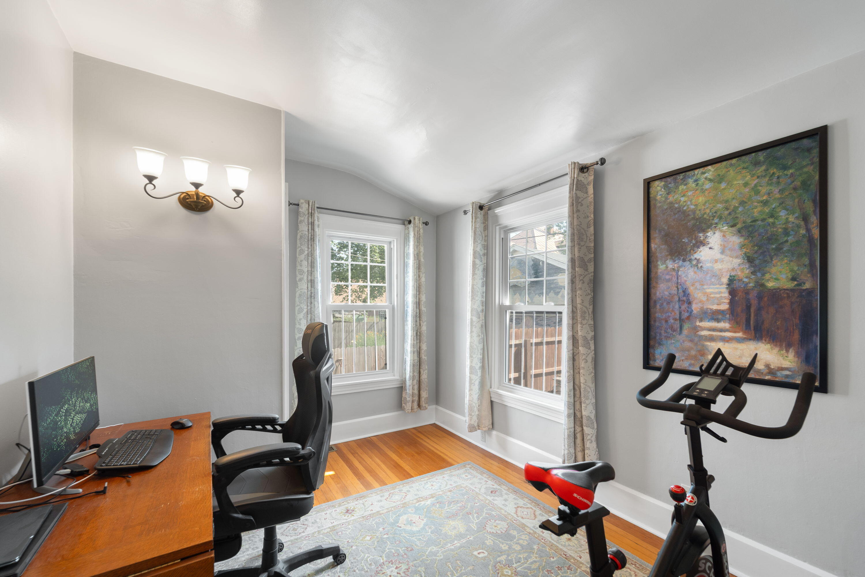 1213 College Avenue Racine, WI 53403 - Photo 10 of 31 Versatile space—perfect as a bedroom, home office, or workout room—highlighted by two large windows that fill the room with natural light.