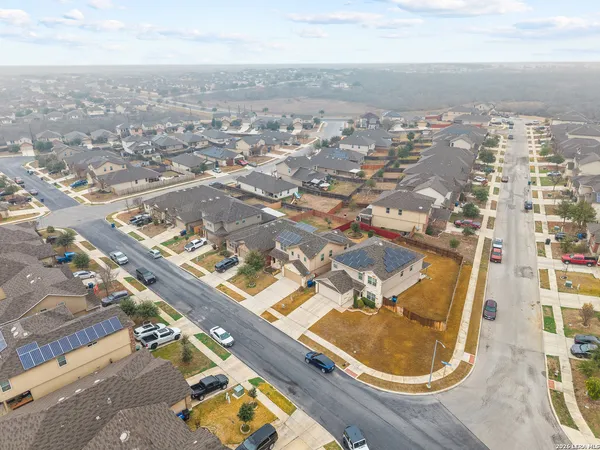 an aerial view of residential houses with outdoor space