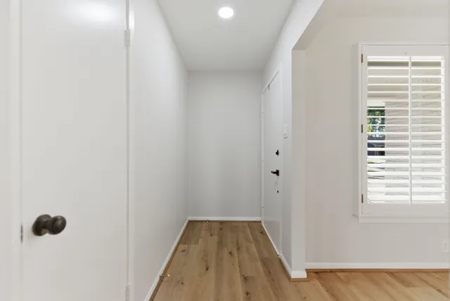 a view of a bathroom from a hallway