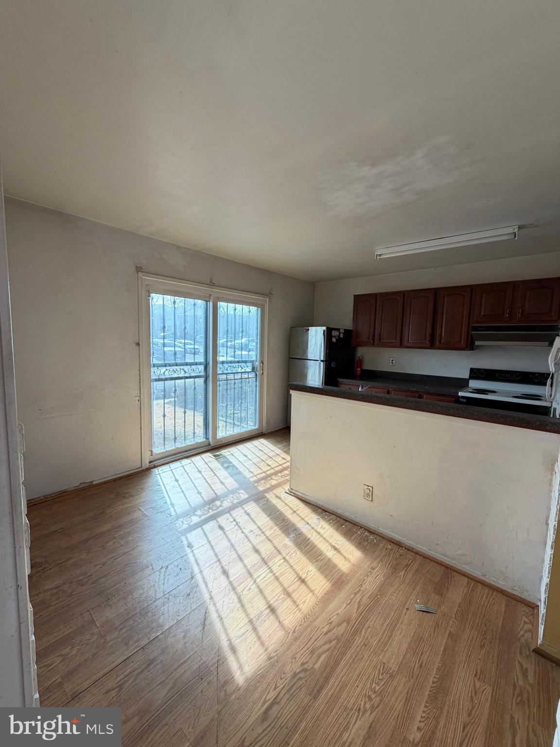 56 Apple Way Frederick, MD 21703 - Photo 4 of 14 a view of kitchen with granite countertop cabinets and outdoor space