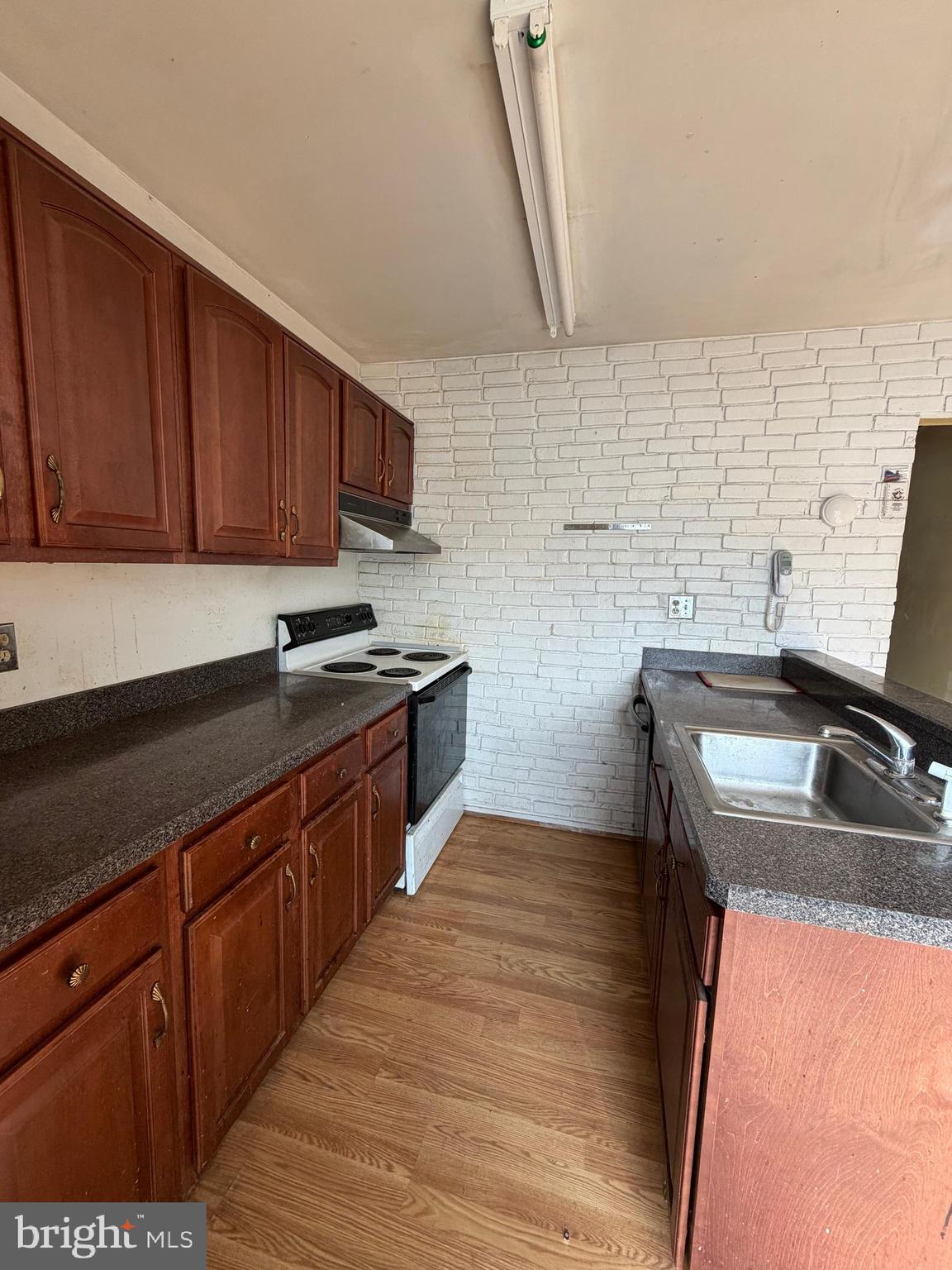 56 Apple Way Frederick, MD 21703 - Photo 6 of 14 a kitchen with stainless steel appliances granite countertop a sink stove and refrigerator
