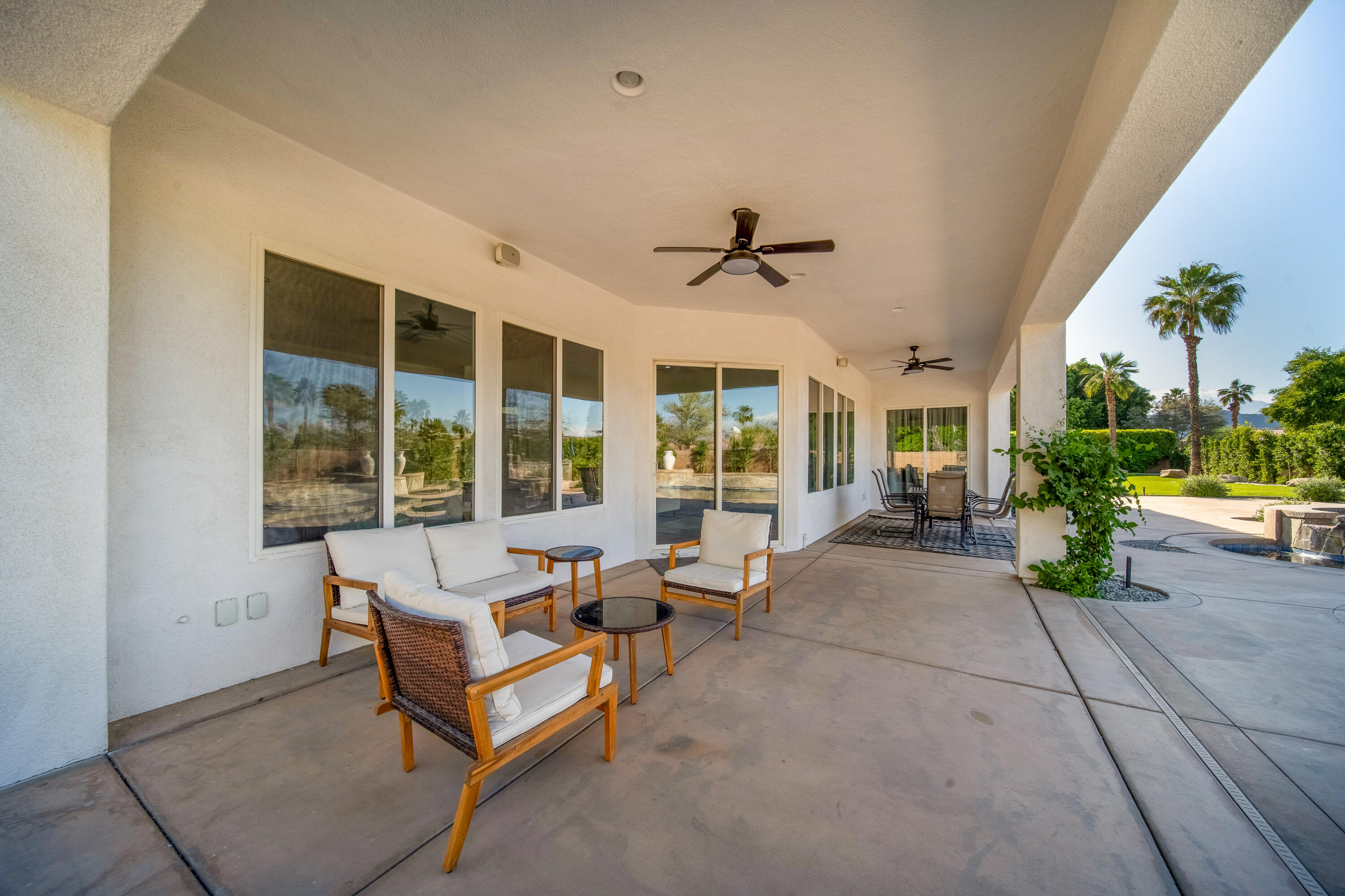 80262 Amazon Avenue Indio, CA 92201 - Photo 55 of 69 a living room with furniture and a large window