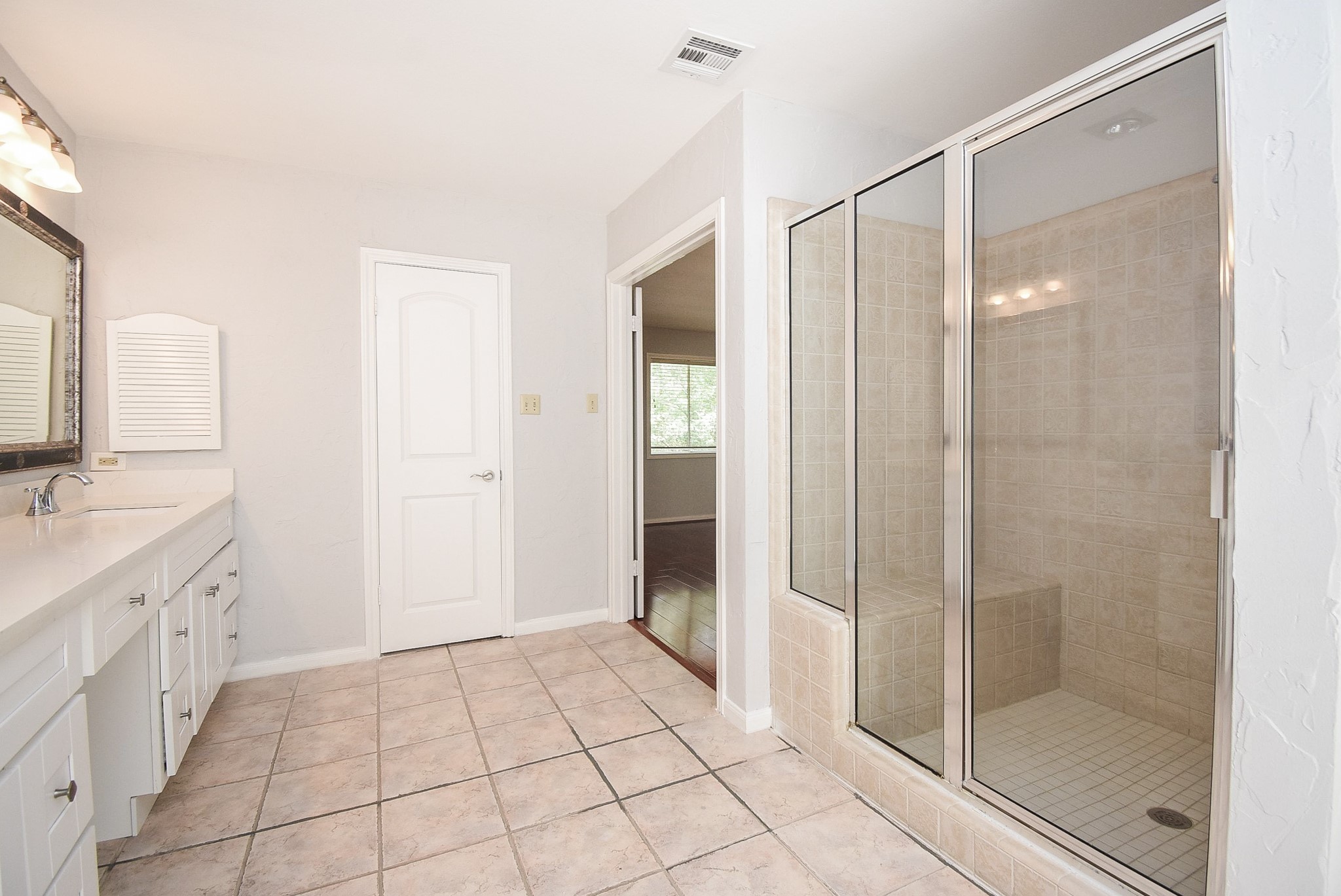 201 Vanderpool Lane, Unit 113 Houston, TX 77024 - Photo 27 of 45 a bathroom with a shower and a sink