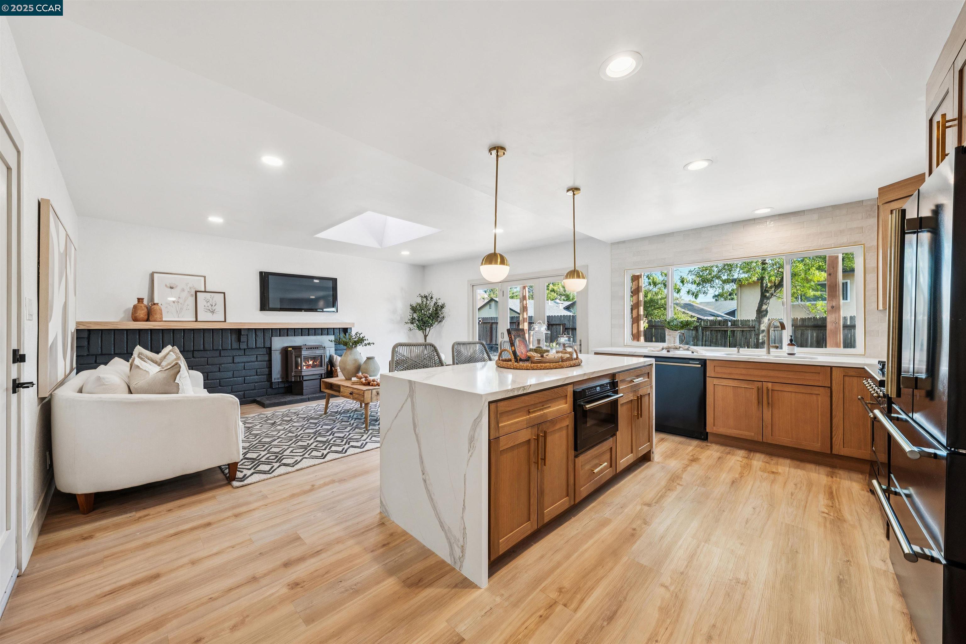 6 San Pedro Place San Ramon, CA 94583 - Photo 11 of 57 a kitchen with stainless steel appliances granite countertop a stove and wooden floor