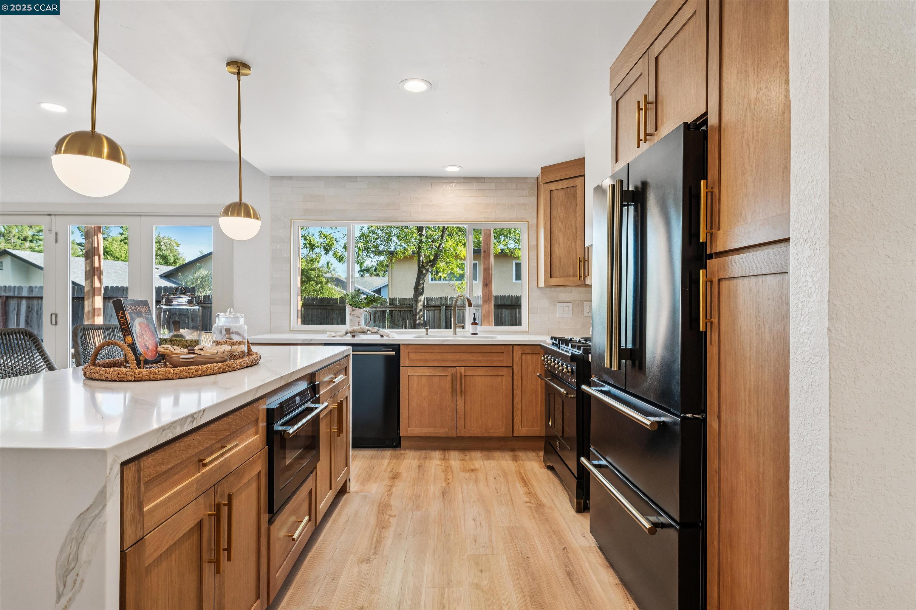 6 San Pedro Place San Ramon, CA 94583 - Photo 14 of 57 a kitchen with stainless steel appliances granite countertop a sink a stove and a refrigerator