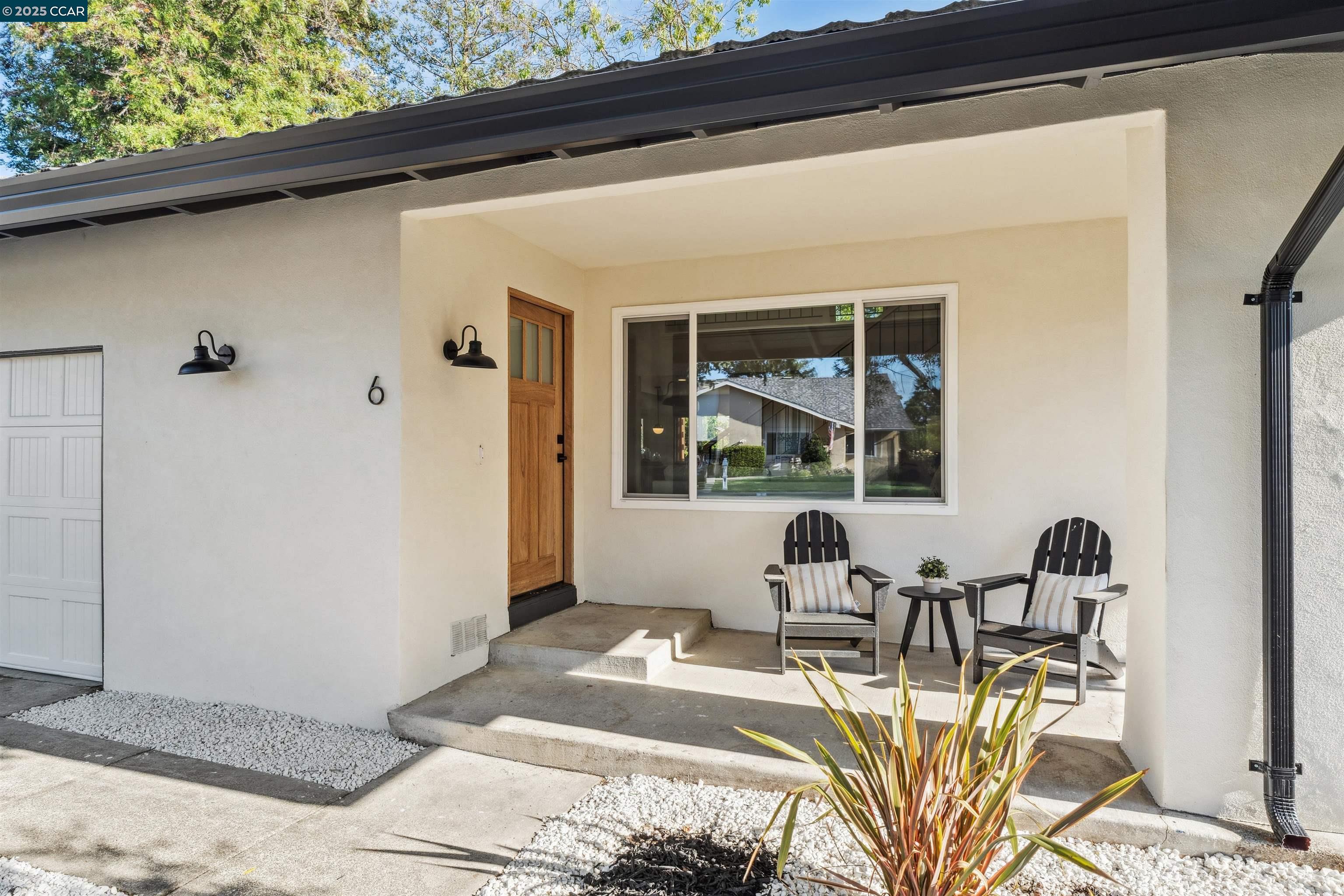 6 San Pedro Place San Ramon, CA 94583 - Photo 2 of 57 a view of a patio with table and chairs and potted plants