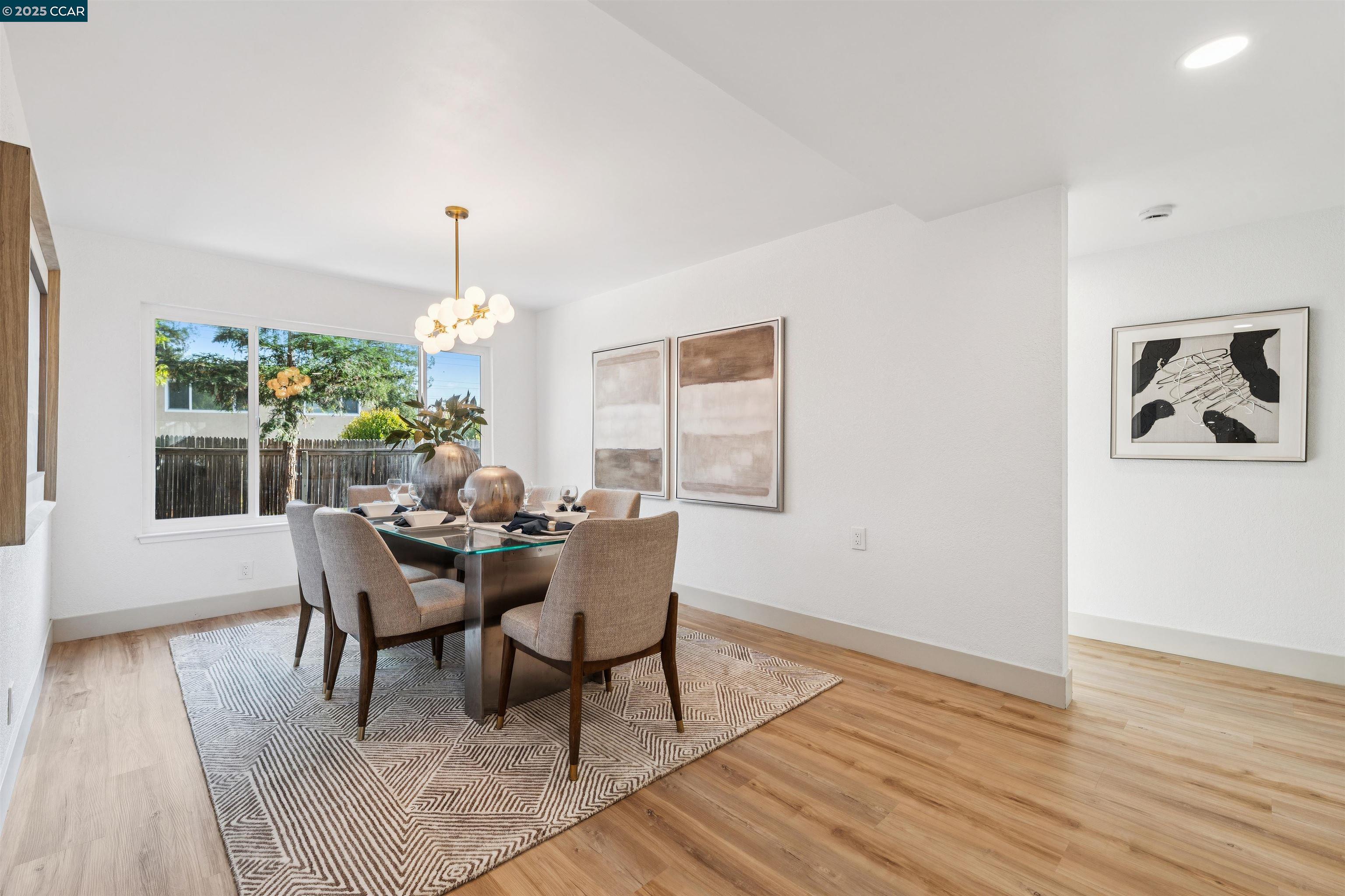 6 San Pedro Place San Ramon, CA 94583 - Photo 21 of 57 a dining room with furniture a rug and a chandelier