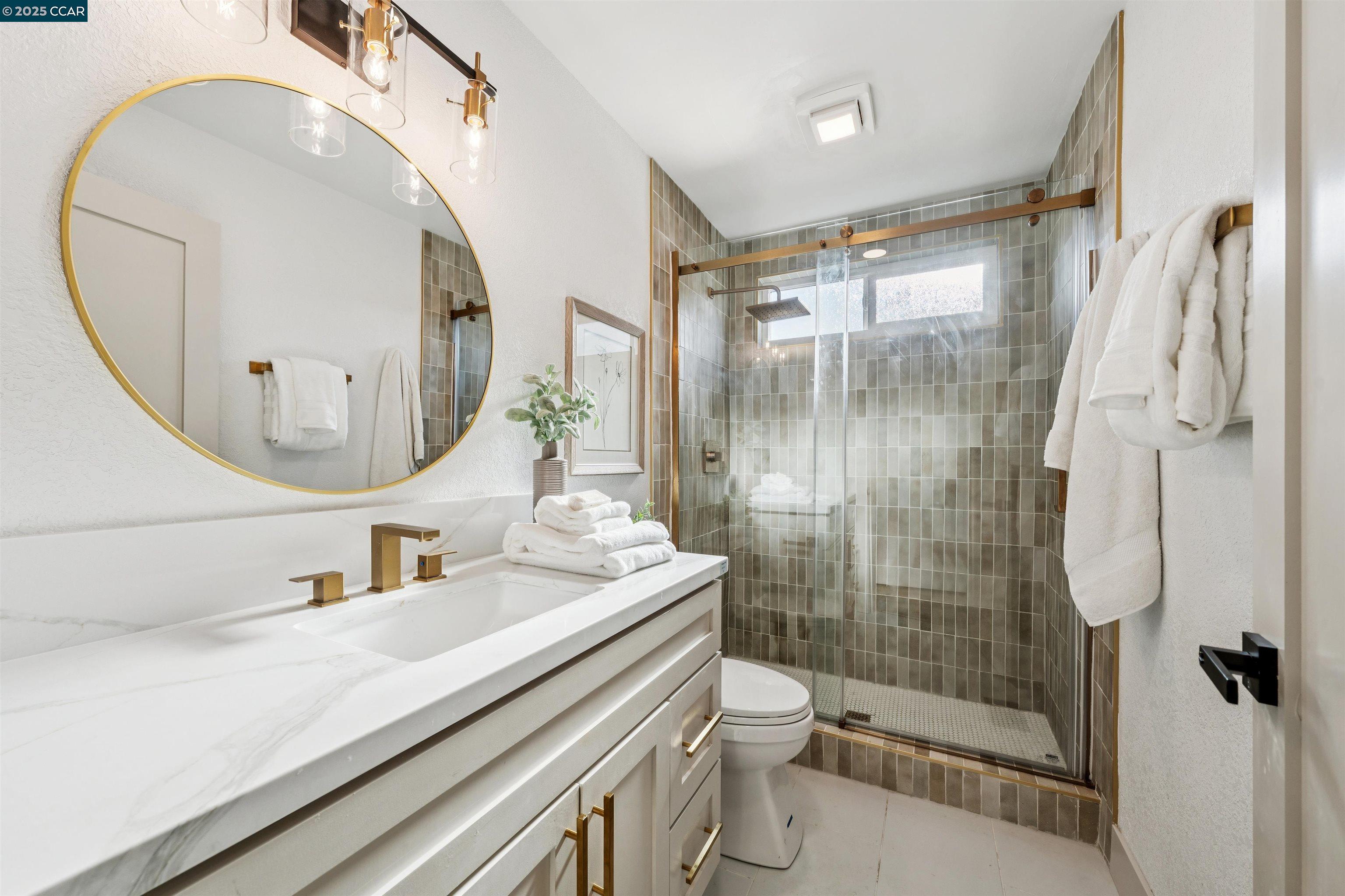 6 San Pedro Place San Ramon, CA 94583 - Photo 26 of 57 a bathroom with a sink a toilet and shower