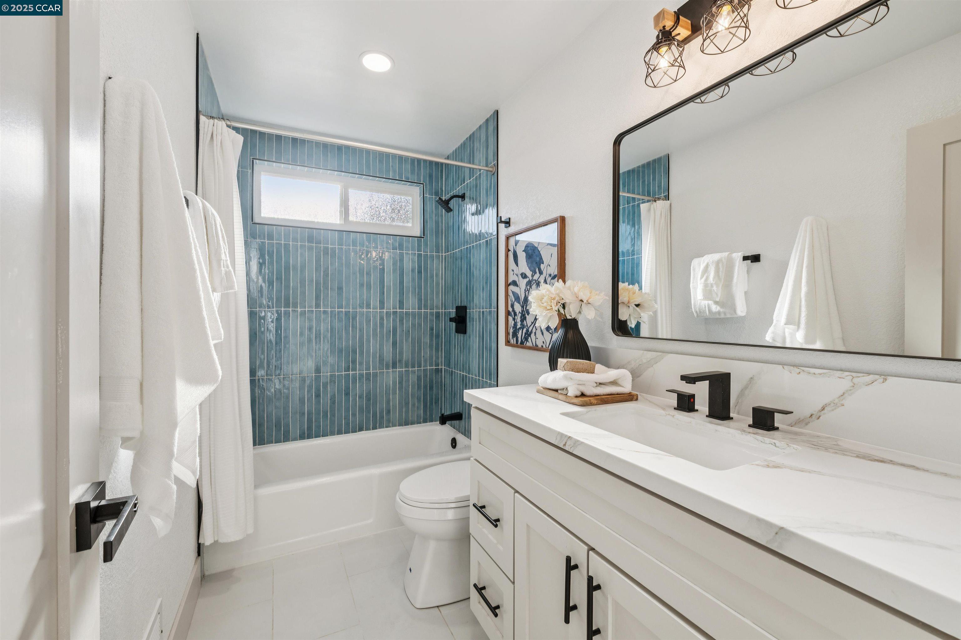 6 San Pedro Place San Ramon, CA 94583 - Photo 30 of 57 a bathroom with a sink a toilet and shower