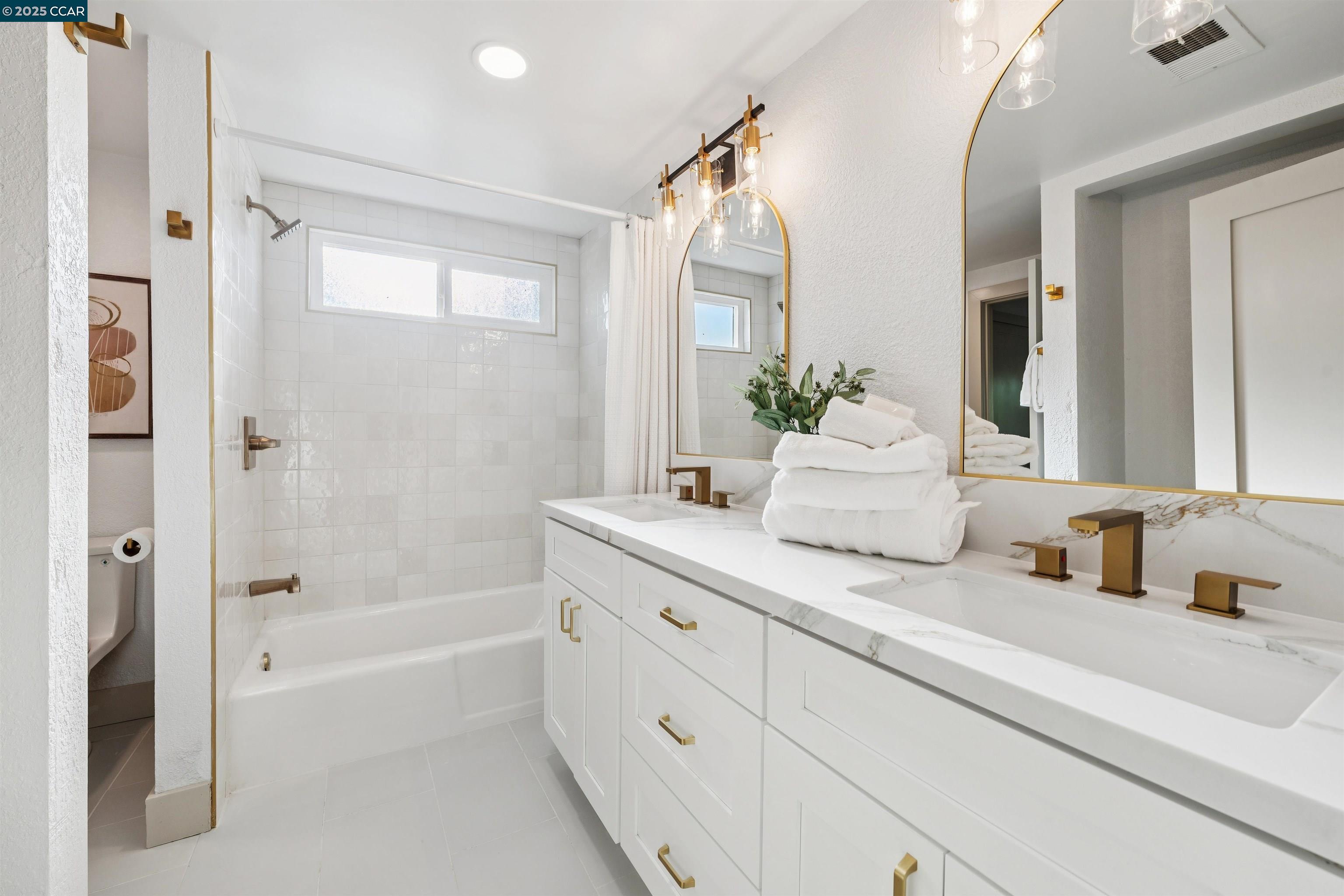 6 San Pedro Place San Ramon, CA 94583 - Photo 38 of 57 a bathroom with a tub sink and mirror