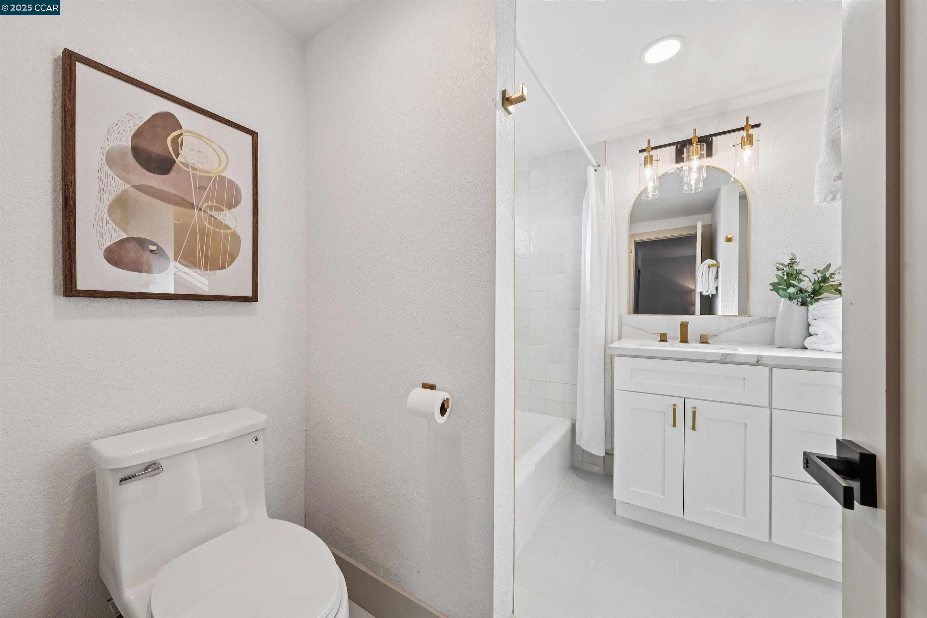 6 San Pedro Place San Ramon, CA 94583 - Photo 40 of 57 a bathroom with a toilet sink and mirror