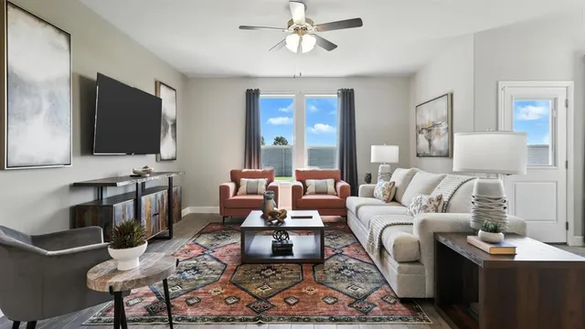 a dining room with furniture and a kitchen view