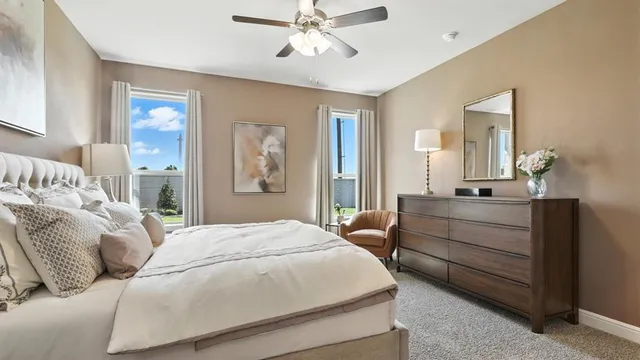 a bedroom with a bed and a lamp