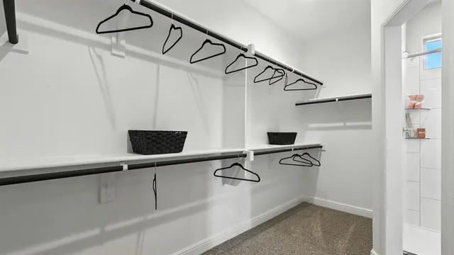 a bathroom with double vanity sinks and a mirror