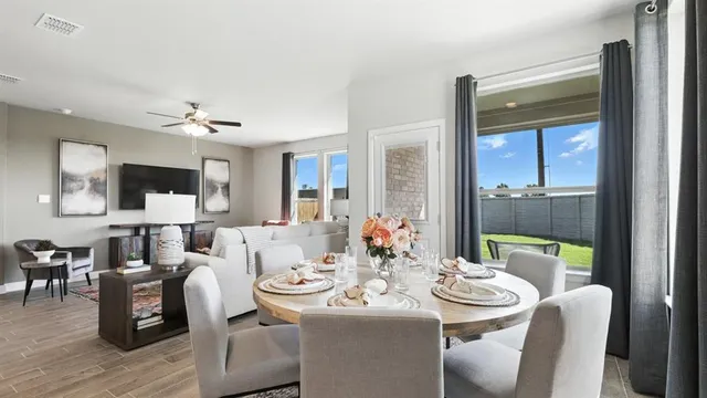 a kitchen with counter space dining table and chairs