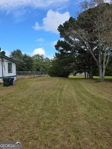 a view of yard with outdoor seating