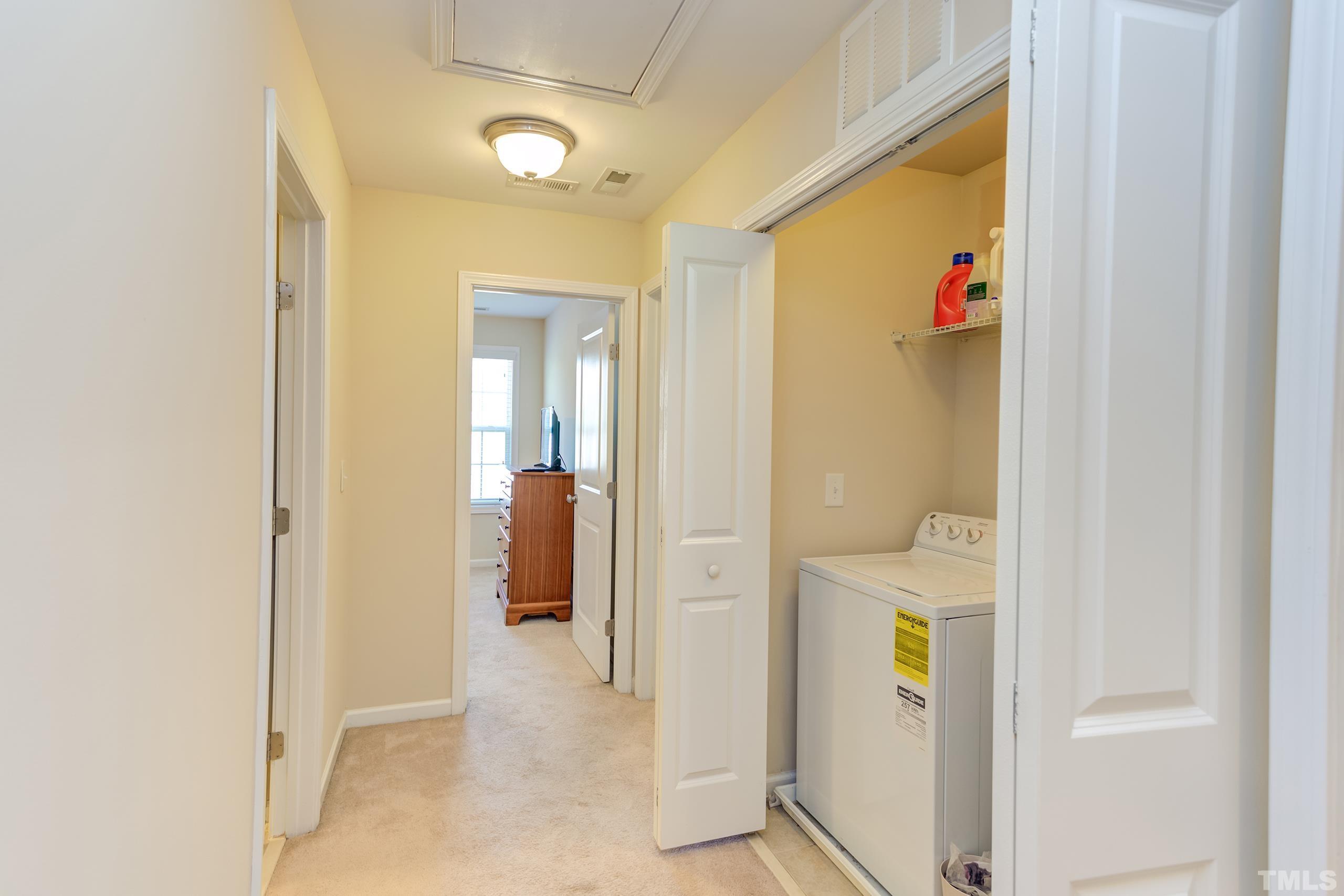 1313 Still Monument Way Raleigh, NC 27603 - Photo 27 of 35 a view of a hallway with closet and a bathroom