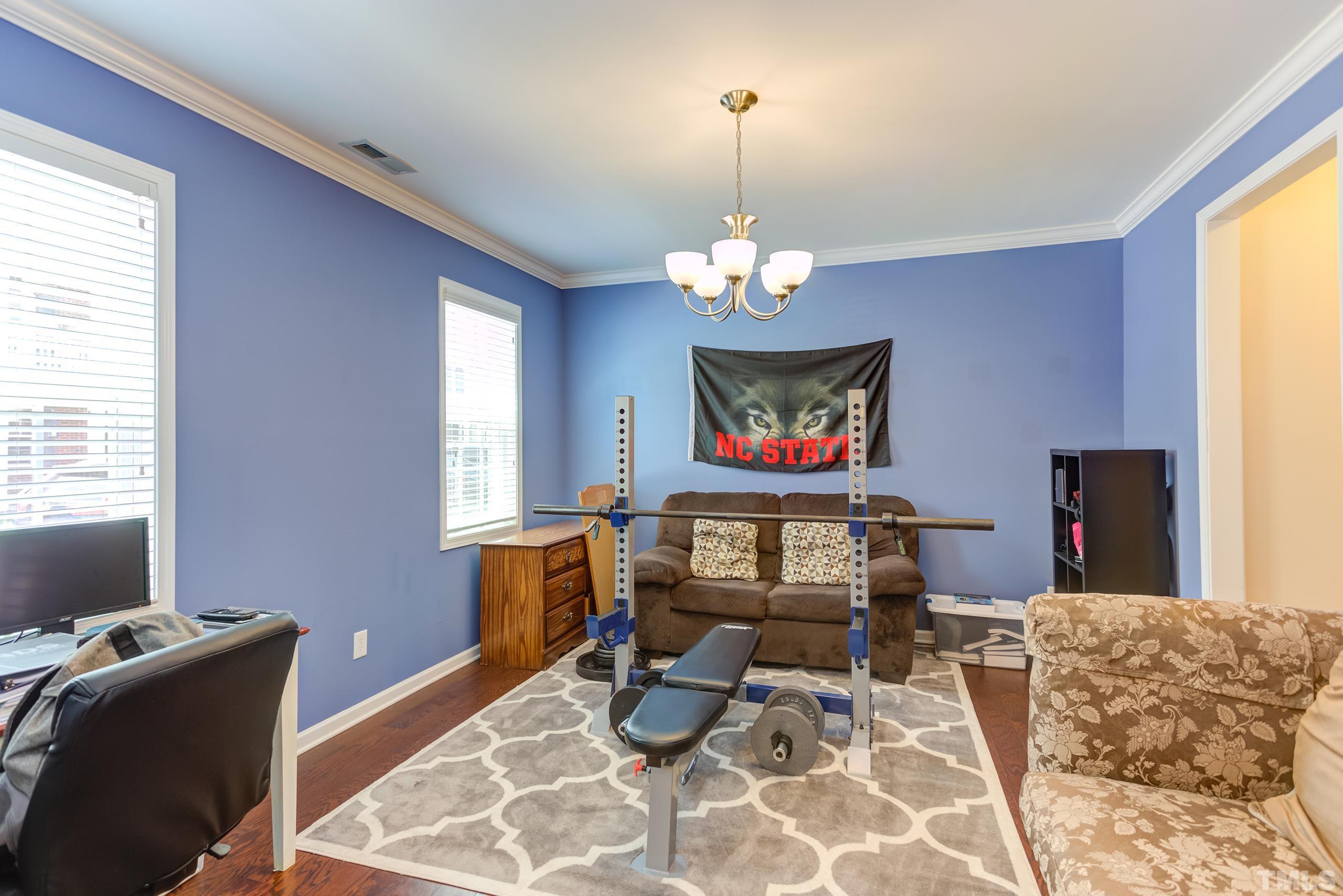 1313 Still Monument Way Raleigh, NC 27603 - Photo 6 of 35 a room with furniture and window