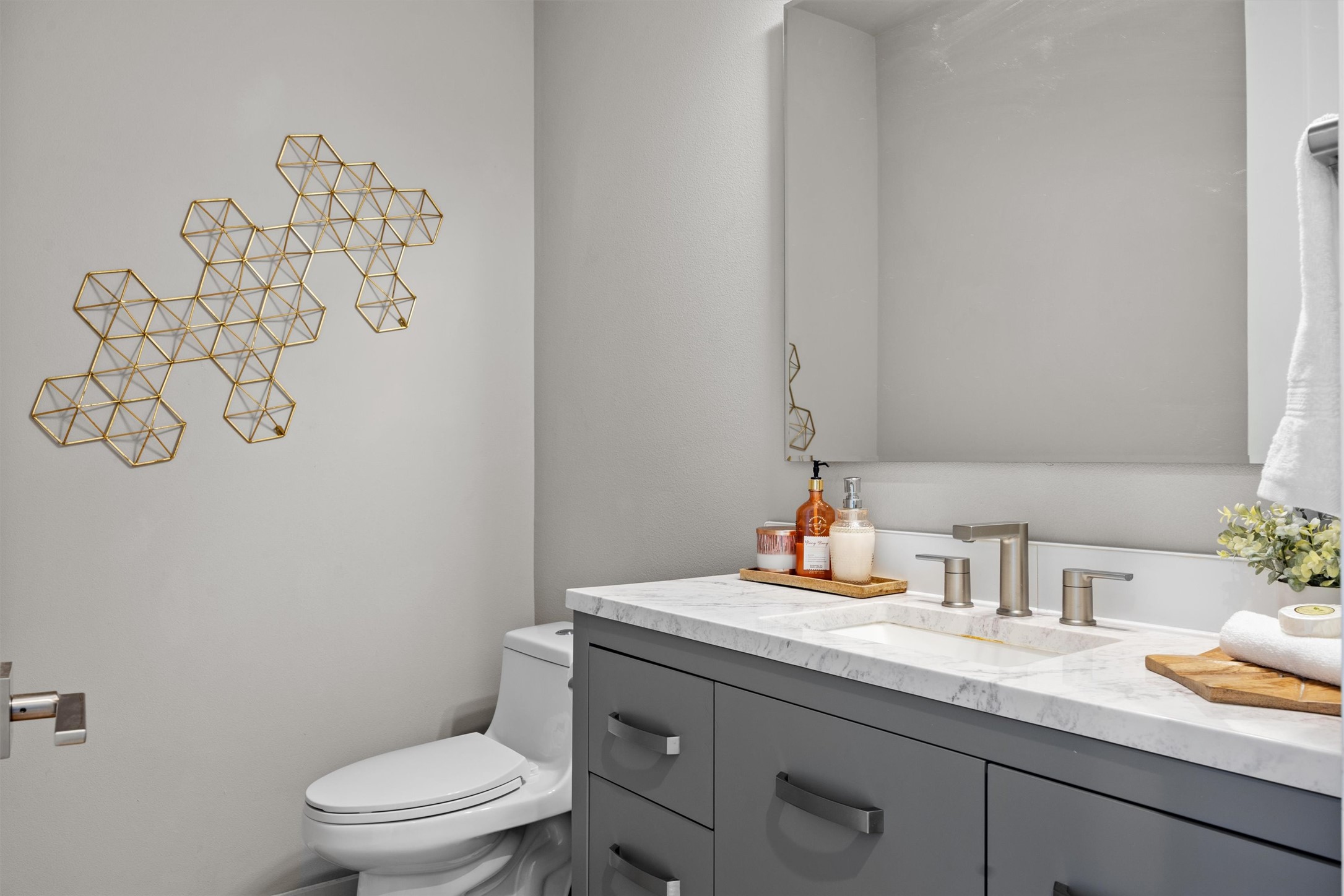 1116 Stobaugh Street, Unit B Austin, TX 78757 - Photo 26 of 38 The half bathroom’s sleek details complement the home’s overall contemporary feel.