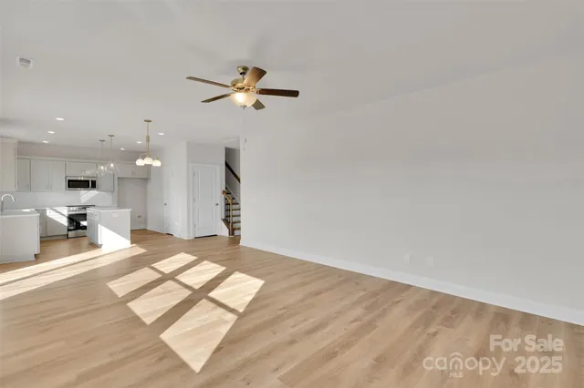 a view of a living room a rug and kitchen view