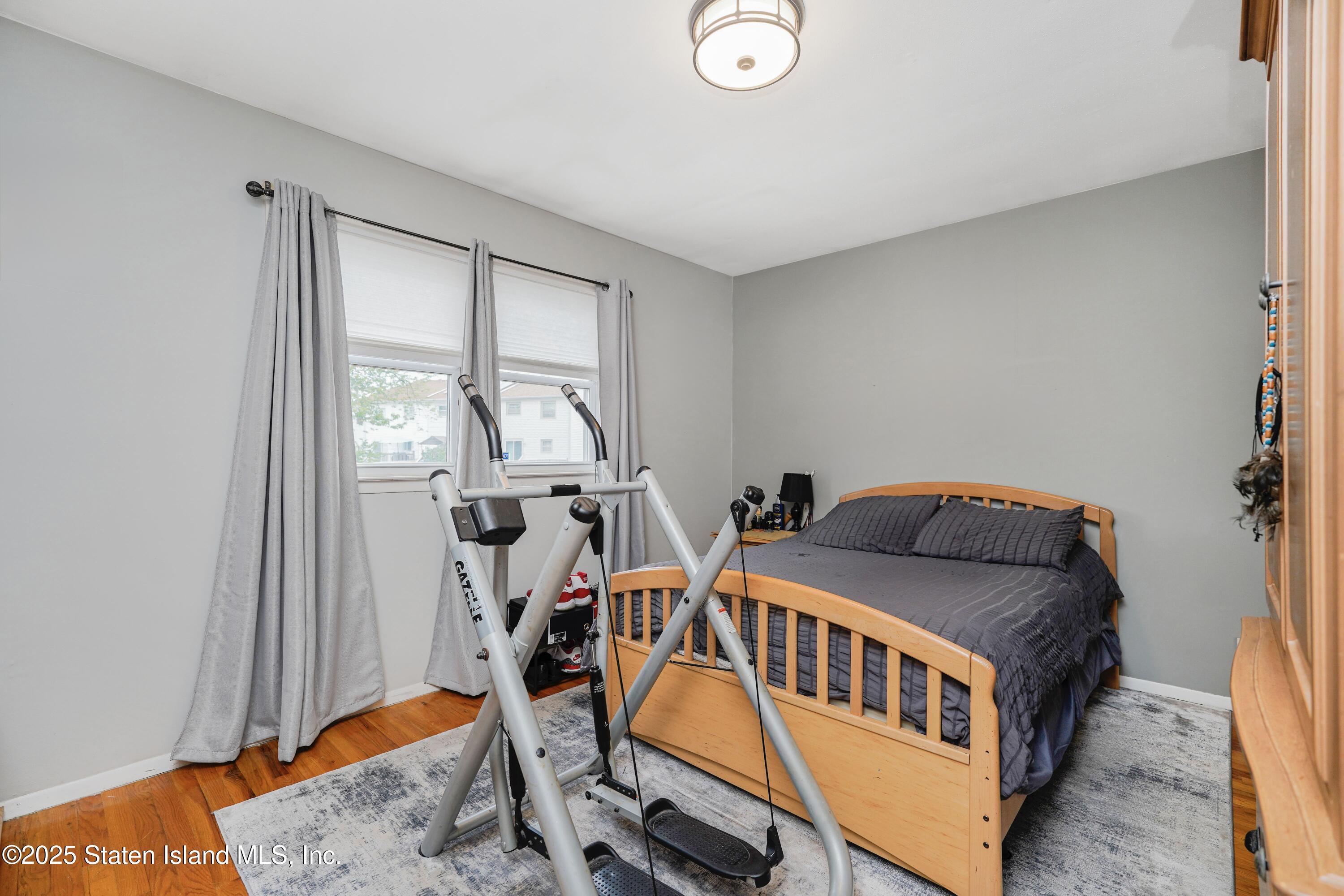 10 Draper Place Staten Island, NY 10314 - Photo 12 of 20 a bedroom with furniture and a window