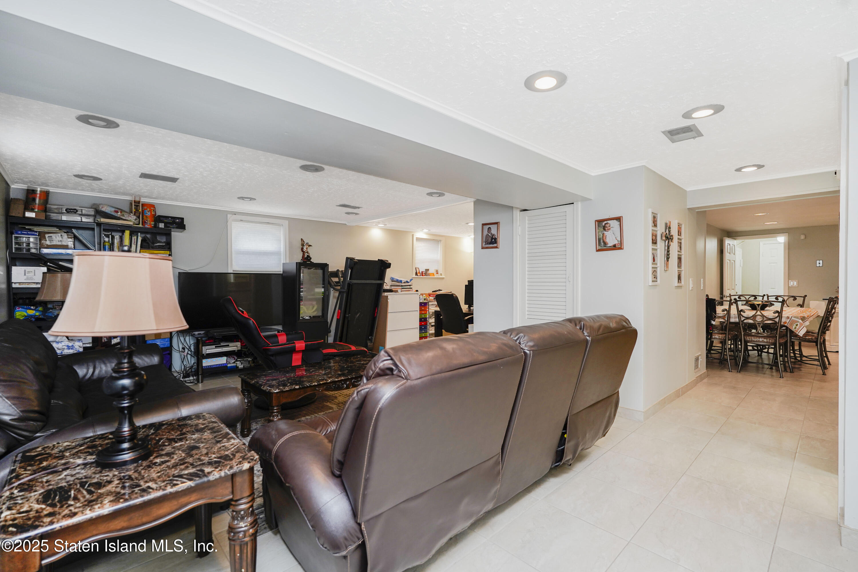 10 Draper Place Staten Island, NY 10314 - Photo 15 of 20 a living room with furniture and a flat screen tv
