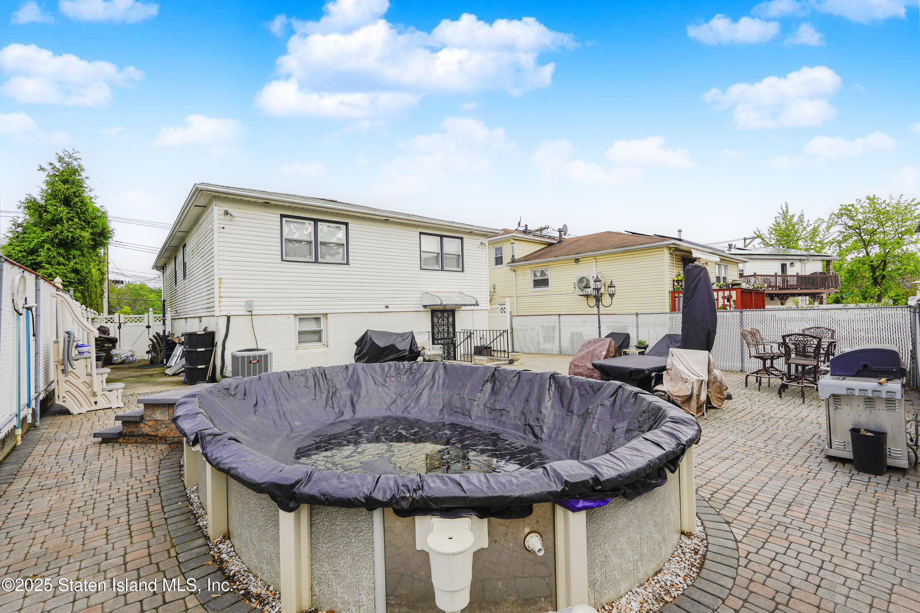 10 Draper Place Staten Island, NY 10314 - Photo 19 of 20 a view of a house with roof and sitting area