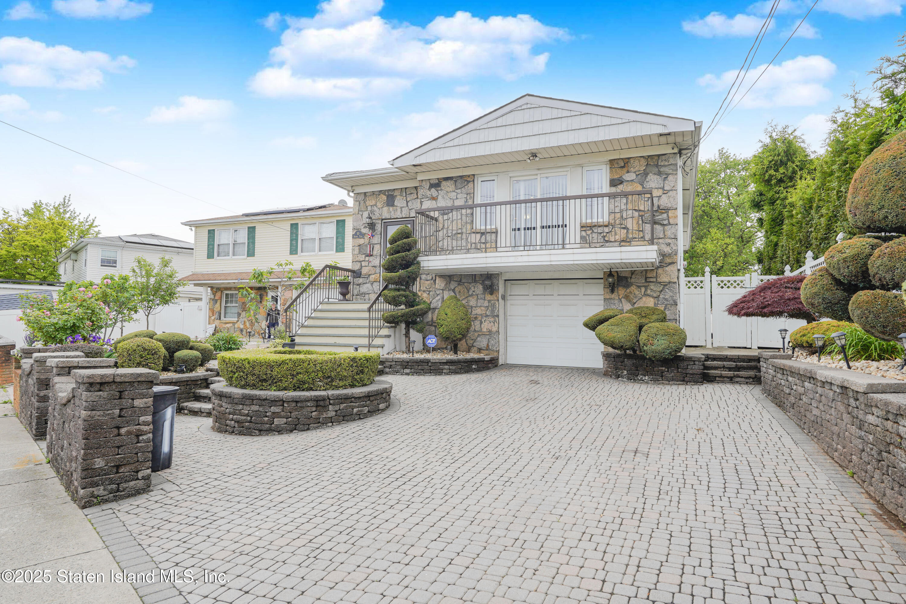 10 Draper Place Staten Island, NY 10314 - Photo 2 of 20 a front view of a house with outdoor seating and a patio