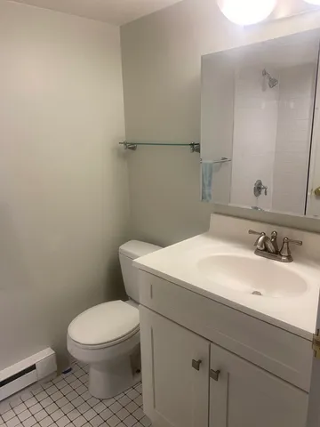 a view of a roof deck dining table and chairs